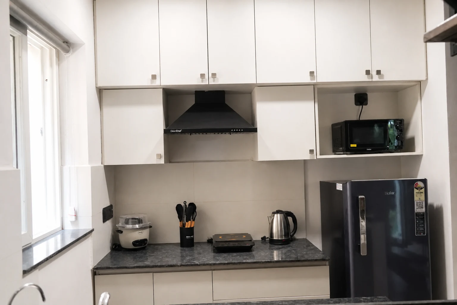 Equipped kitchen inside a LuxStayz Loft apartment