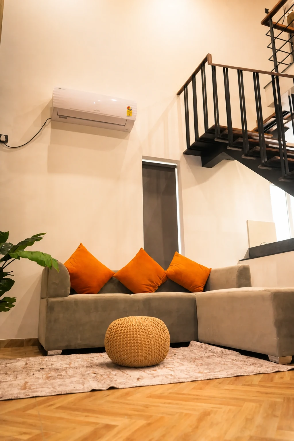 Double-height living area and staircase in a LuxStayz Loft Premium apartment