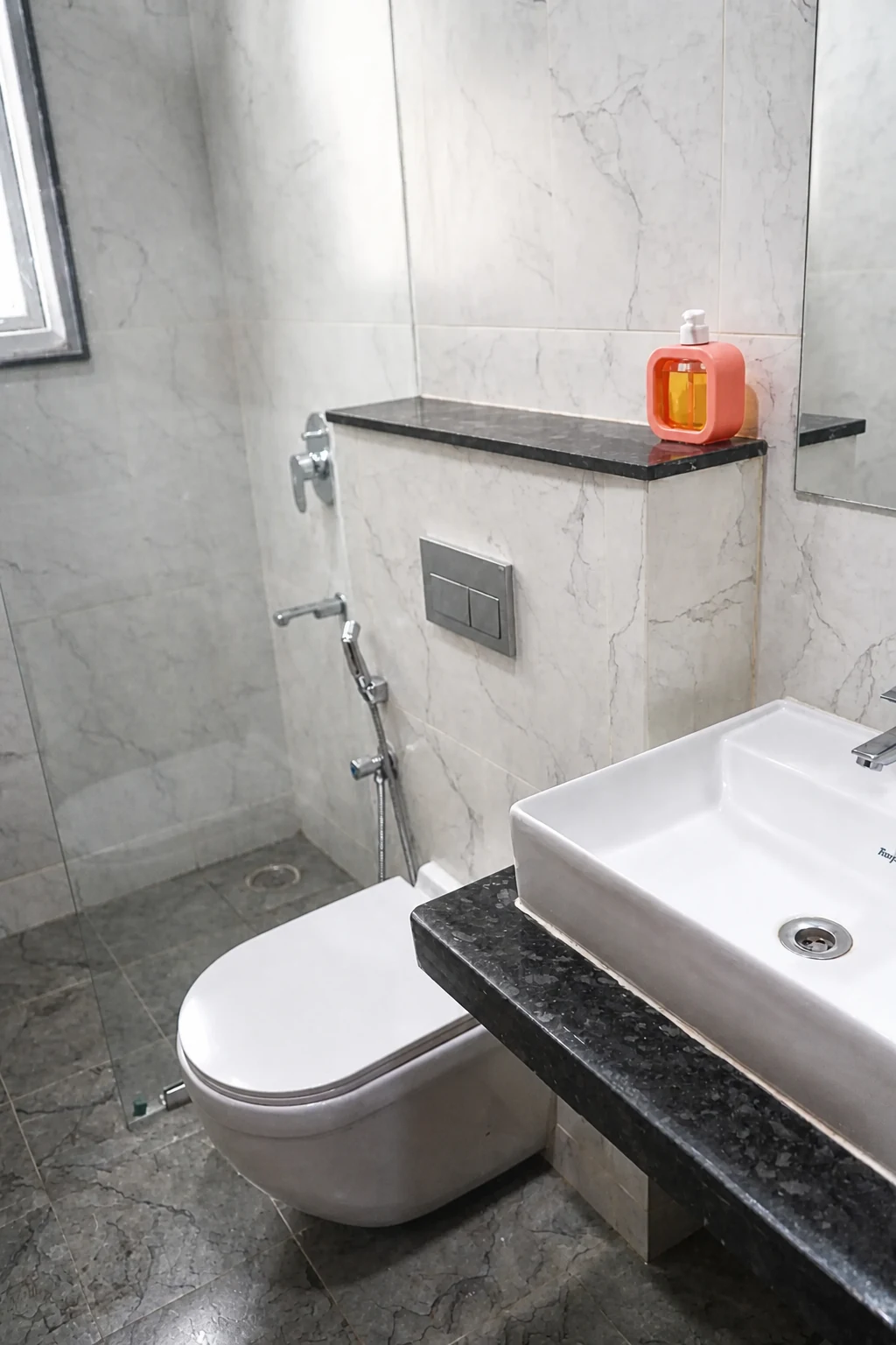 Wash basin and fixtures in the 1BHK Premium bathroom