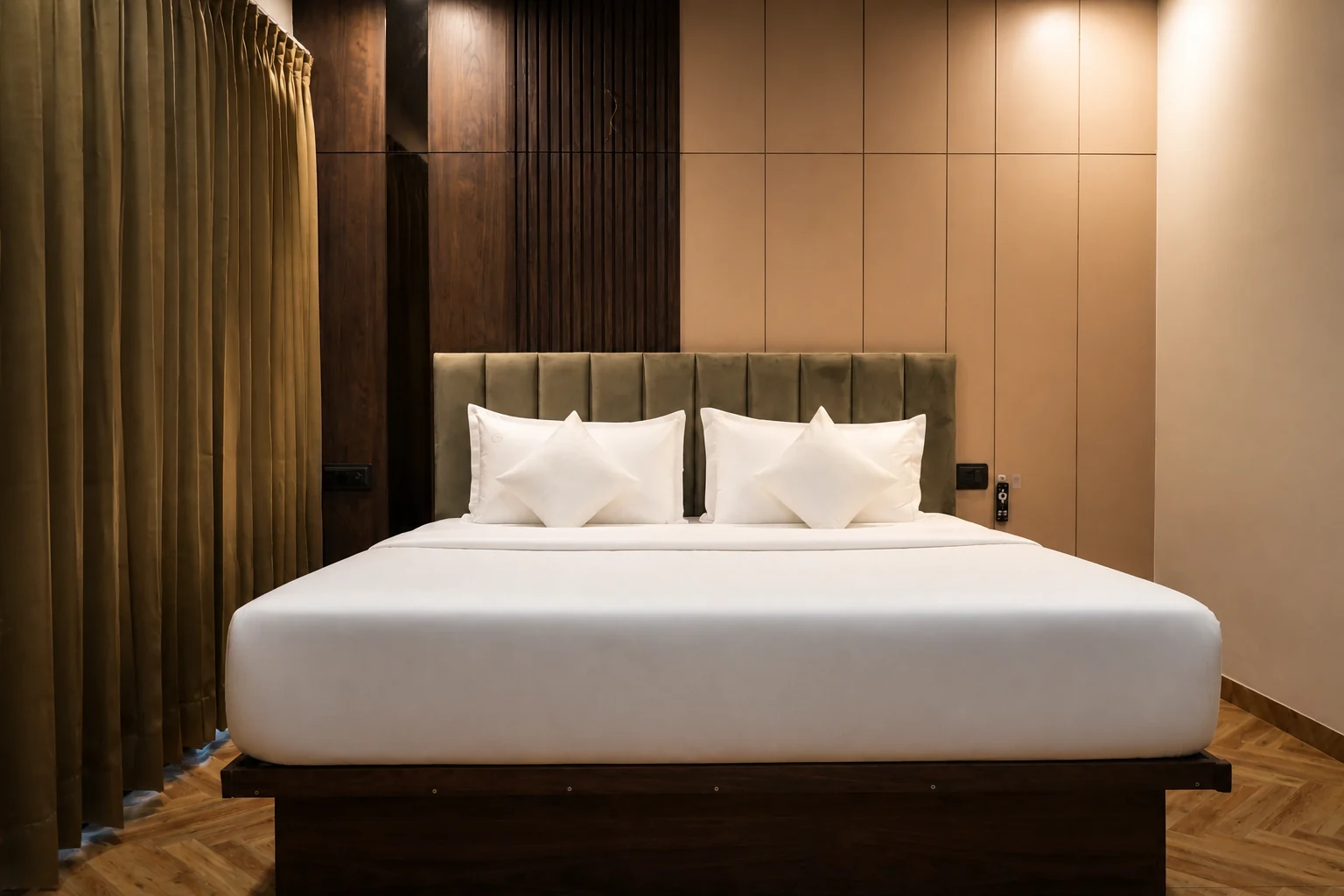 Front view of the king-size bed in a LuxStayz 1BHK Premium apartment