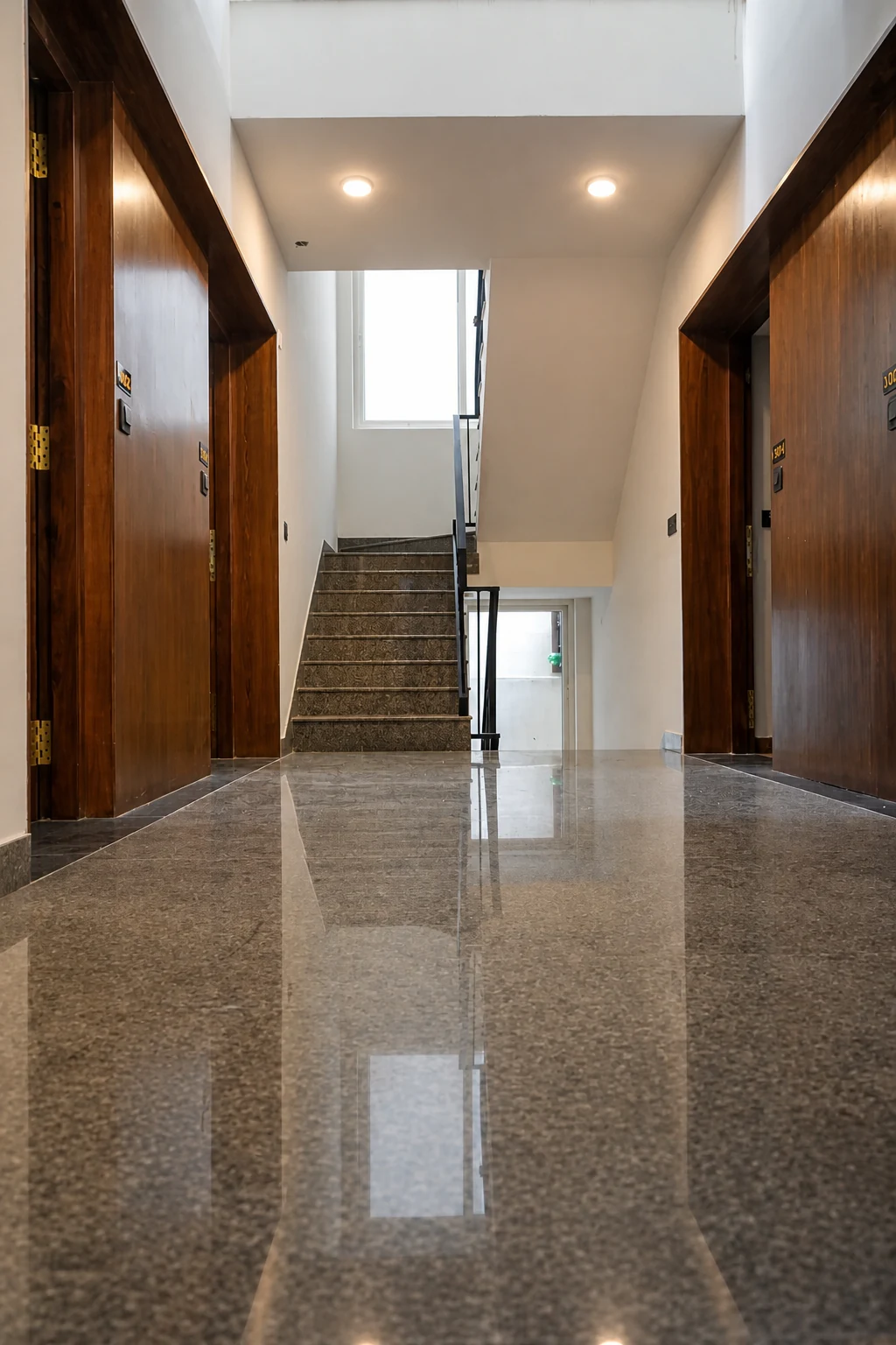 Shared corridor and stairs inside the LuxStayz residence